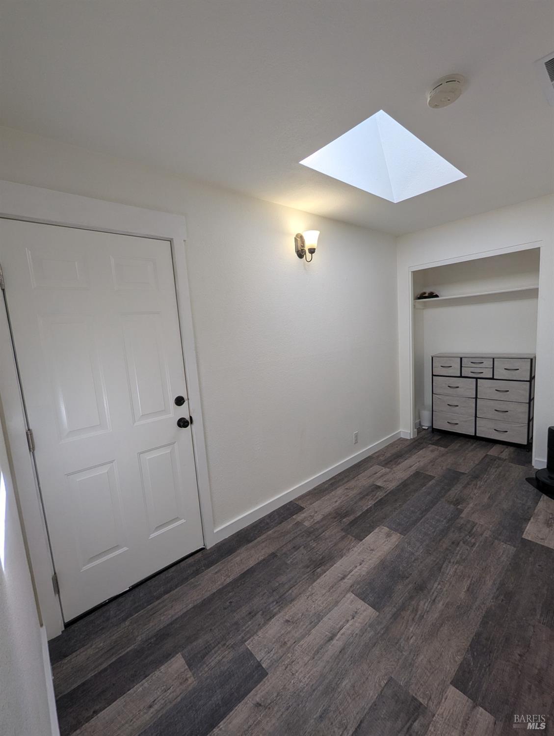 112 East Agua Caliente Road Sonoma, CA 95476 - Photo 13 of 20 an empty room with wooden floor and closet