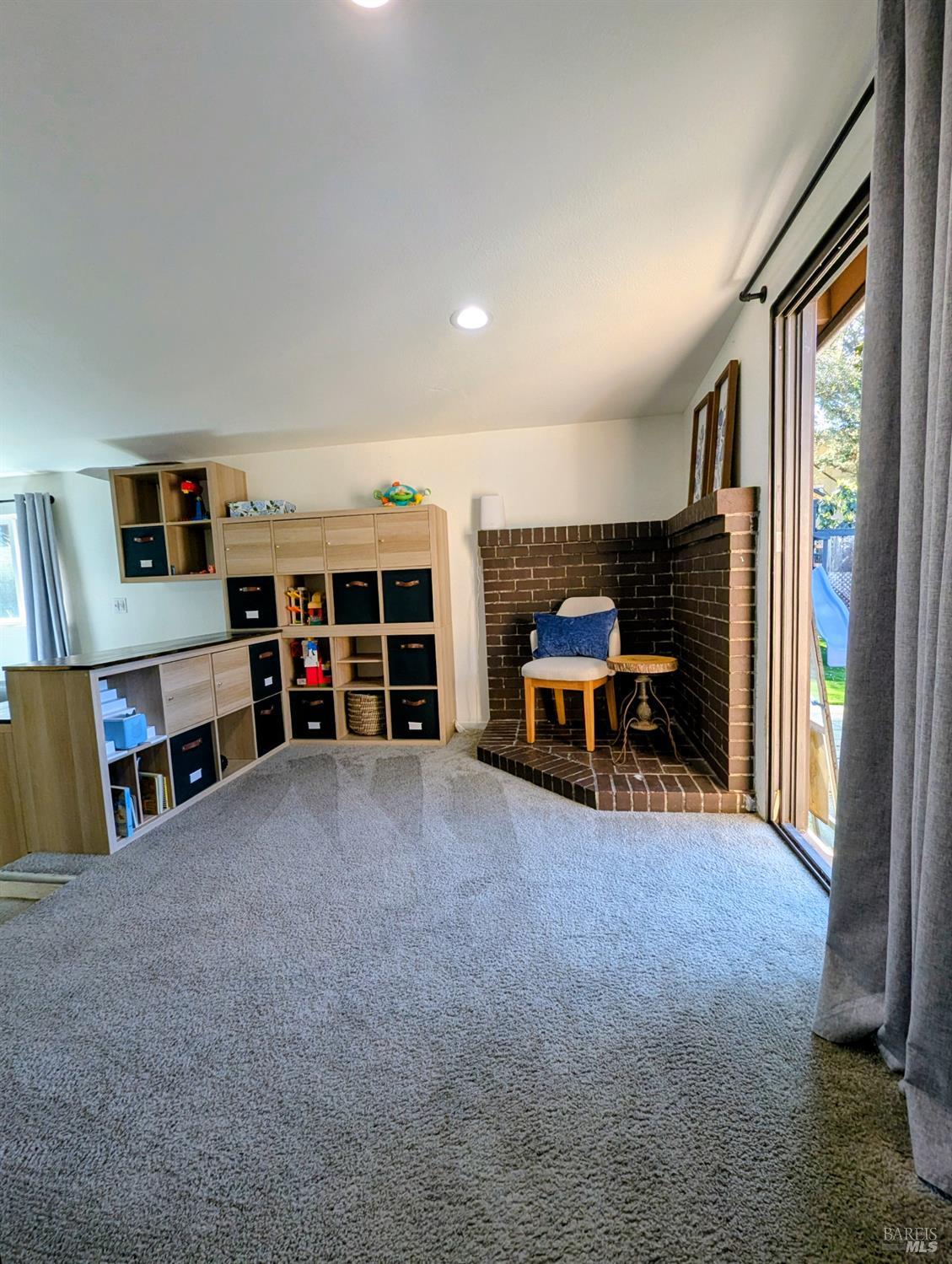 112 East Agua Caliente Road Sonoma, CA 95476 - Photo 14 of 20 a living room with furniture and a flat screen tv