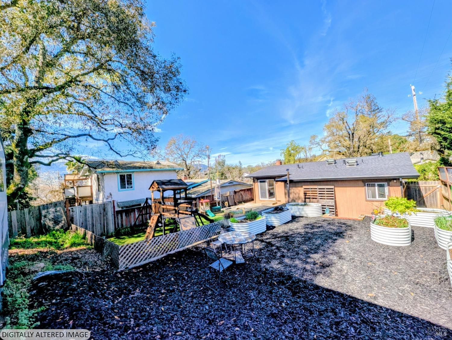 112 East Agua Caliente Road Sonoma, CA 95476 - Photo 19 of 20 a view of a chairs and table in a backyard