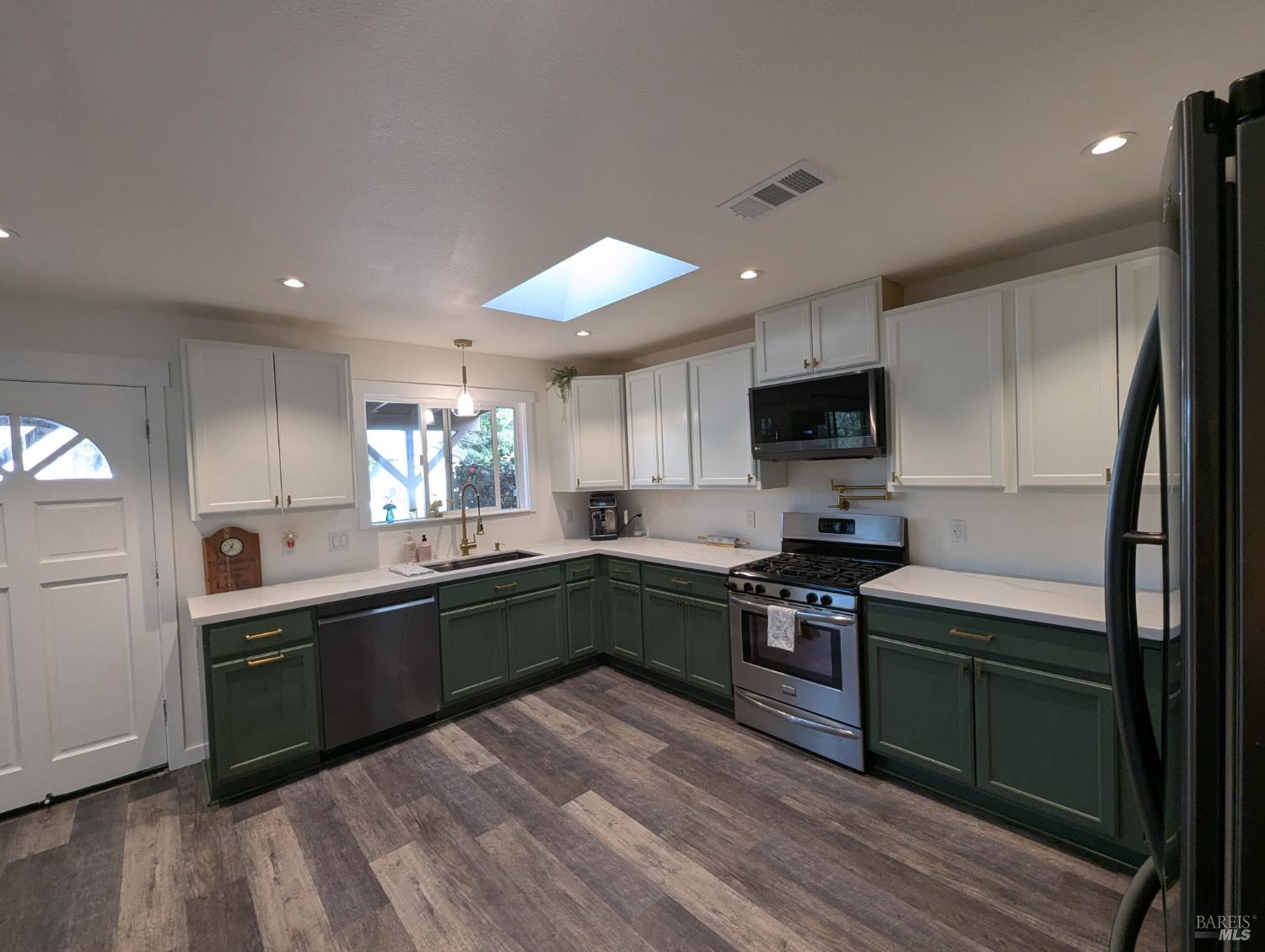 112 East Agua Caliente Road Sonoma, CA 95476 - Photo 7 of 20 a kitchen with stainless steel appliances granite countertop a sink and stove top oven