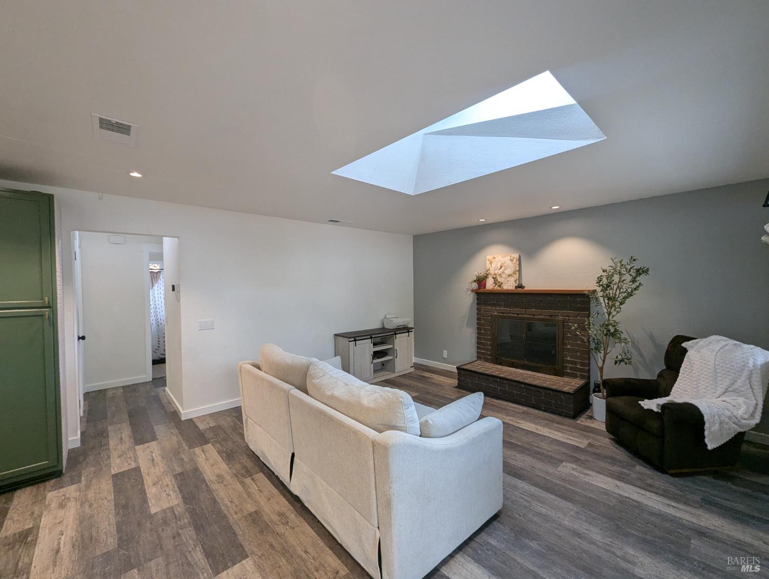 112 East Agua Caliente Road Sonoma, CA 95476 - Photo 8 of 20 a living room with furniture and a fireplace