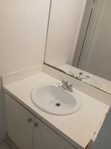 a bathroom with a sink and a vanity