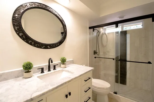 a bathroom with a sink double vanity and a mirror