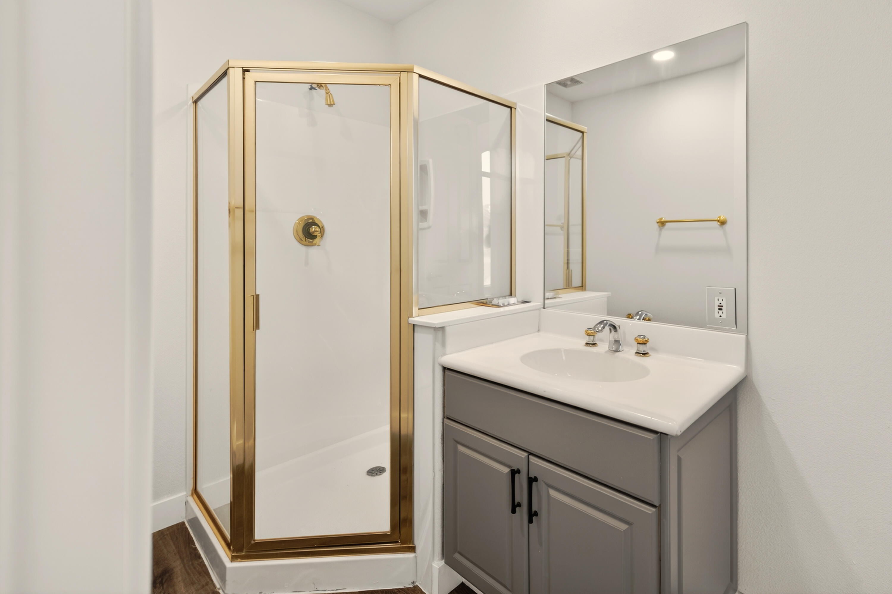 6 Queens Court Rancho Mirage, CA 92270 - Photo 24 of 28 a bathroom with a sink a mirror a vanity and a shower