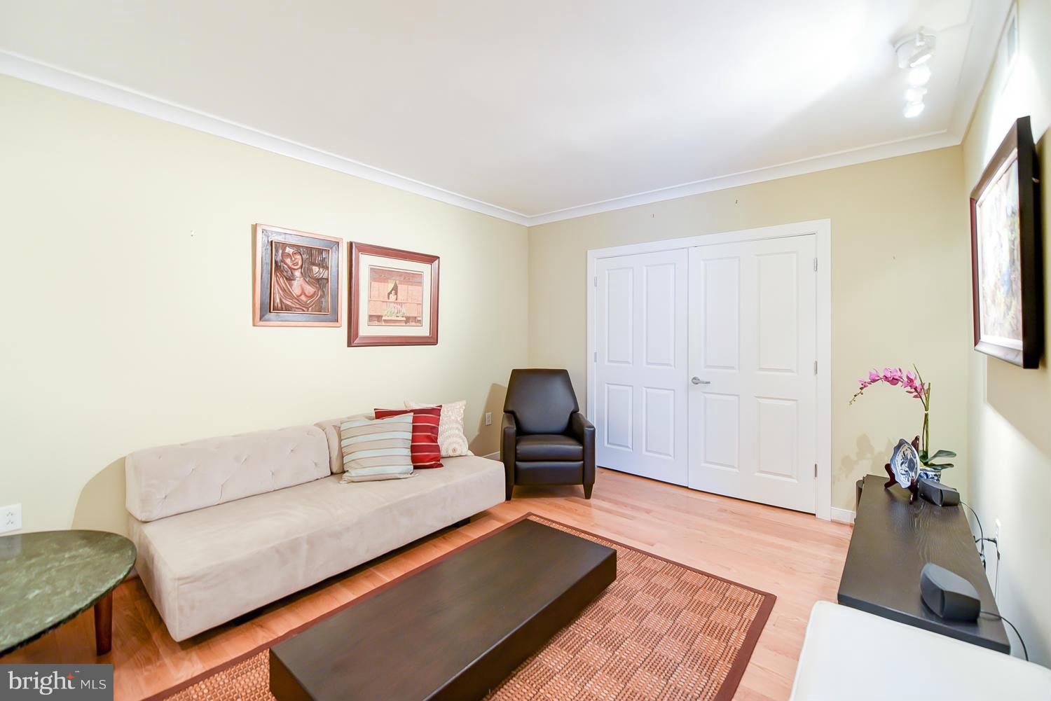 777 7th Street Northwest, Unit 1113 Washington, DC 20001 - Photo 12 of 30 a living room with furniture