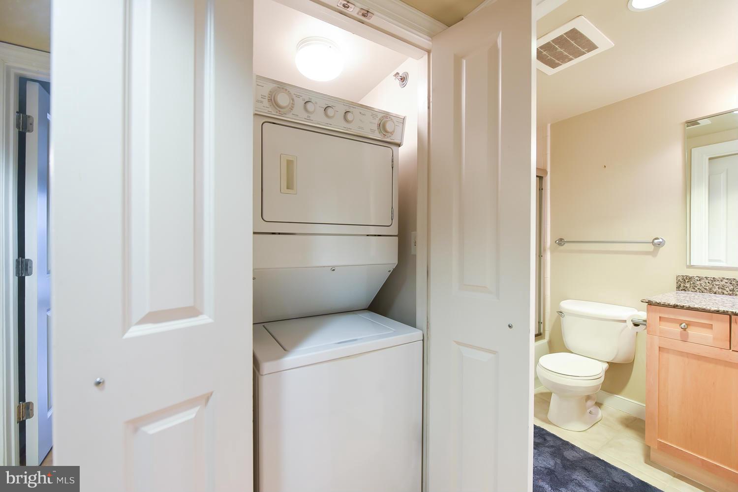 777 7th Street Northwest, Unit 1113 Washington, DC 20001 - Photo 21 of 30 a white toilet sitting next to a bathroom sink