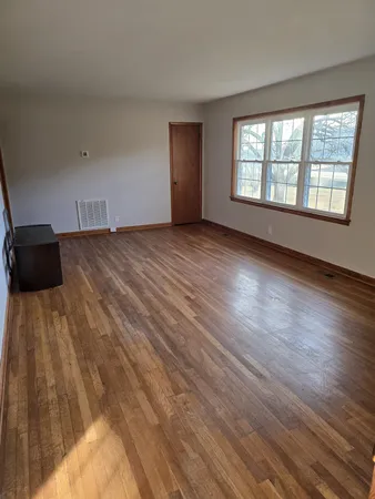 a view of an empty room and window