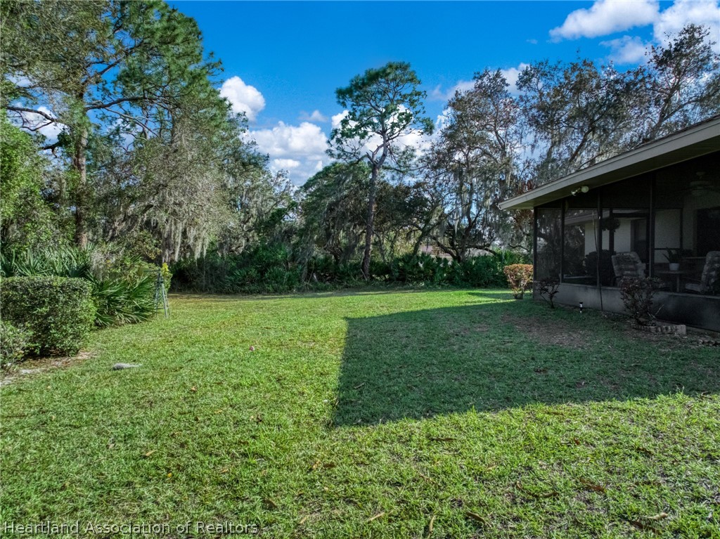 5802 Golden Road Sebring, FL 33875 - Photo 30 of 37 a view of a backyard with large trees
