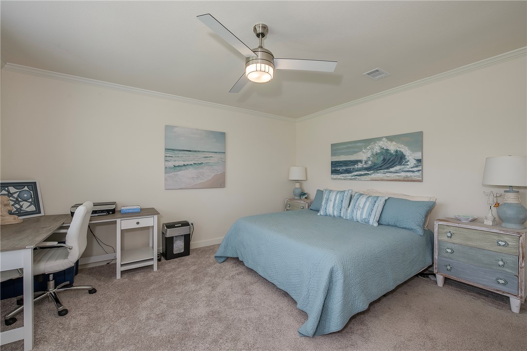 10976 Whiterock Road Bremond, TX 76629 - Photo 15 of 42 a bedroom with a bed a desk and chair