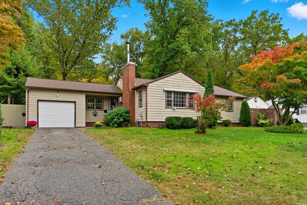 193 Roy Street Springfield, MA 01104 - Photo 1 of 40 a front view of a house with a yard and garage
