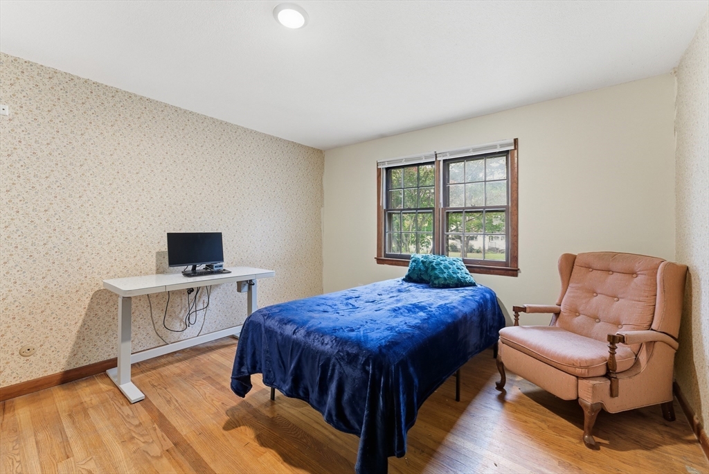 193 Roy Street Springfield, MA 01104 - Photo 19 of 40 a bedroom with a bed and a desk