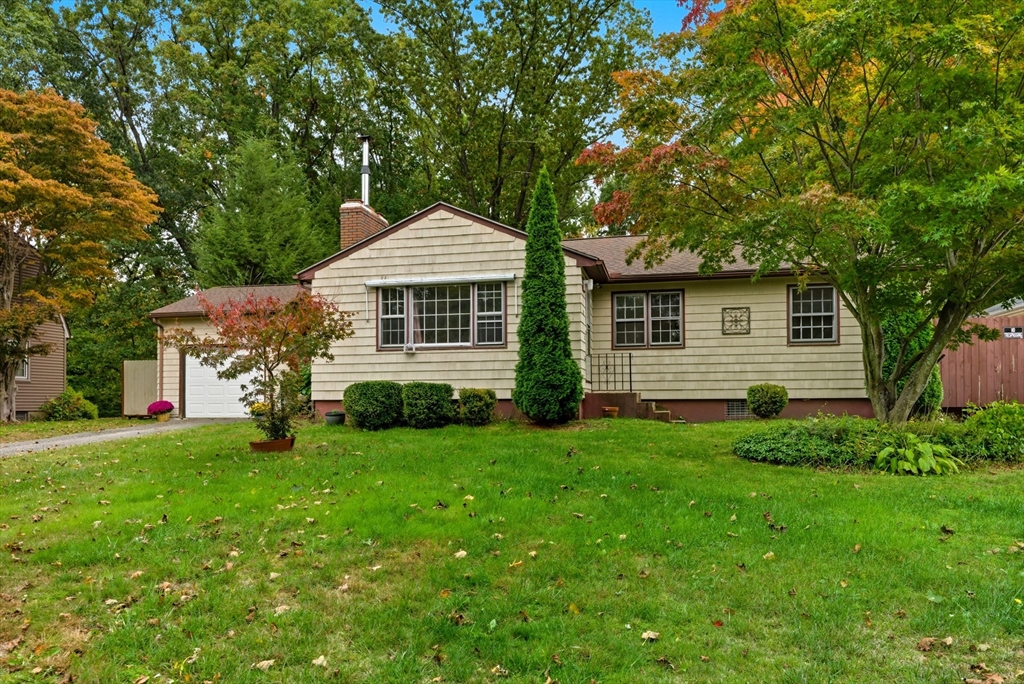 193 Roy Street Springfield, MA 01104 - Photo 3 of 40 a front view of a house with a yard