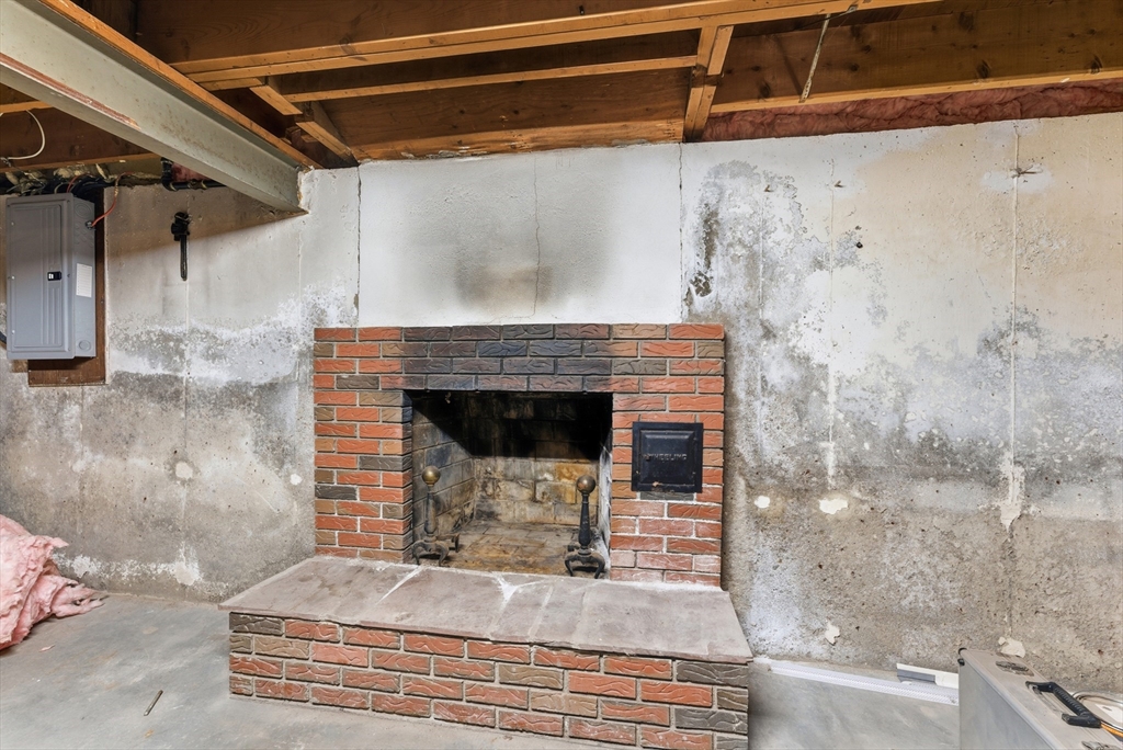 193 Roy Street Springfield, MA 01104 - Photo 35 of 40 a bedroom with a bed and a fireplace