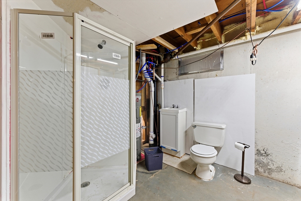 193 Roy Street Springfield, MA 01104 - Photo 36 of 40 a bathroom with a toilet and a shower