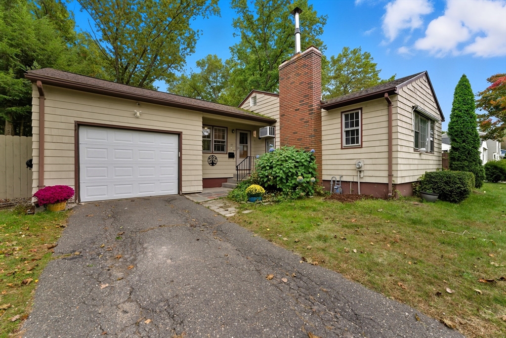 193 Roy Street Springfield, MA 01104 - Photo 4 of 40 a view of a house with yard and garage