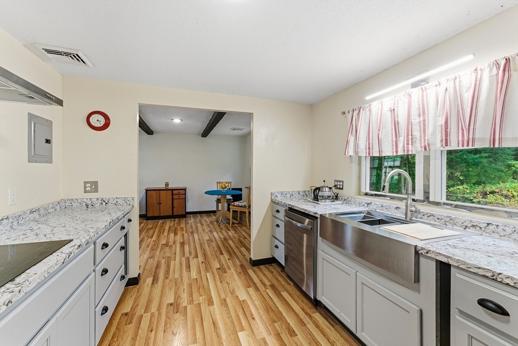 193 Roy Street Springfield, MA 01104 - Photo 9 of 40 a kitchen with a sink stove and cabinets