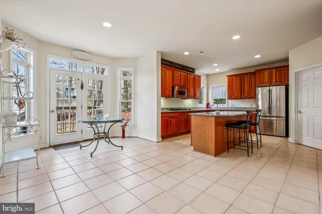 a view of a livingroom with entryway and furniture