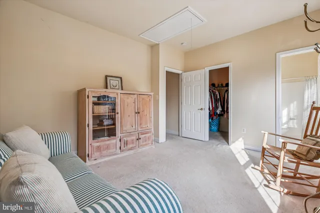 a sign board with yard of the house