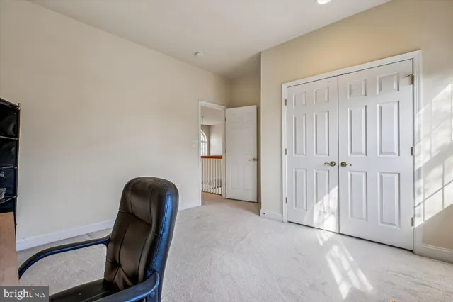 a view of a building with sitting area