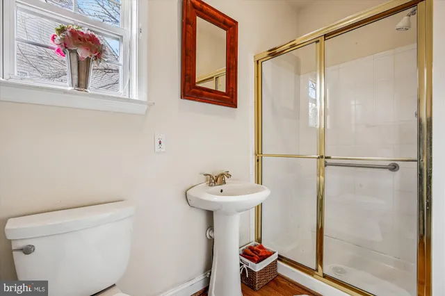a bathroom with a sink and a window