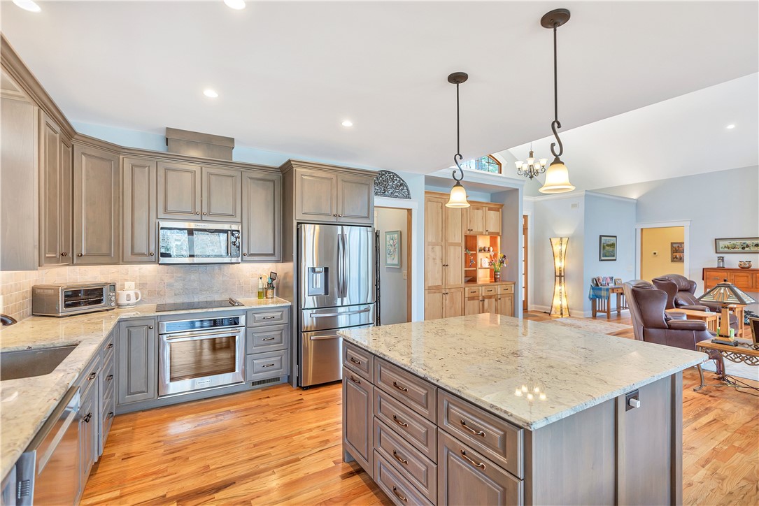 10 Admiral Lane Salem, SC 29676 - Photo 16 of 43 This spacious kitchen features sleek appliances and a generous island, flowing seamlessly into the adjacent living space.