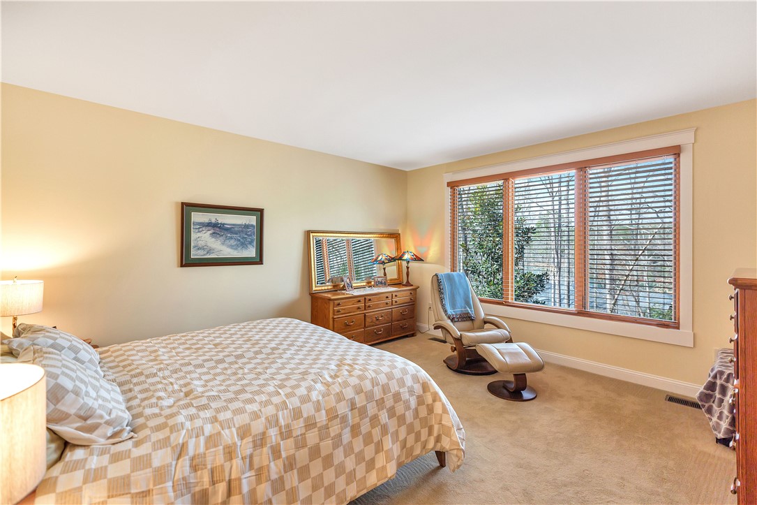 10 Admiral Lane Salem, SC 29676 - Photo 19 of 43 This spacious bedroom offers serene views and a comfortable atmosphere for peaceful relaxation.