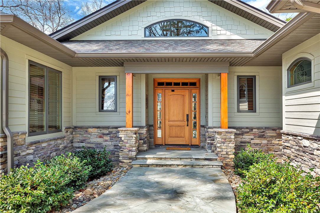 10 Admiral Lane Salem, SC 29676 - Photo 2 of 43 This inviting home showcases a beautiful natural wood door and elegant stone accents.