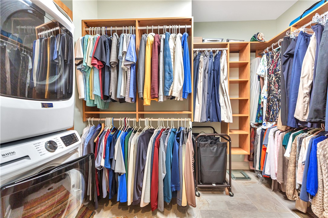10 Admiral Lane Salem, SC 29676 - Photo 21 of 43 This spacious walk-in closet offers ample storage with built-in shelving and convenient laundry appliances.