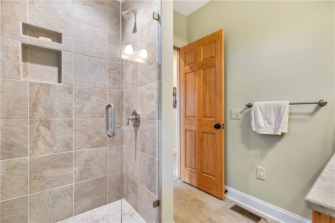 10 Admiral Lane Salem, SC 29676 - Photo 27 of 43 This bathroom features a sleek tiled shower with convenient recessed shelving.
