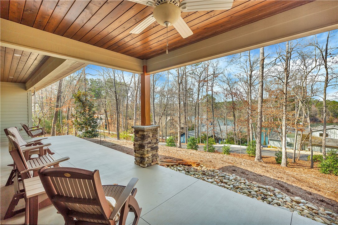 10 Admiral Lane Salem, SC 29676 - Photo 31 of 43 Enjoy tranquil lake views from this expansive covered patio, perfect for relaxing outdoors.