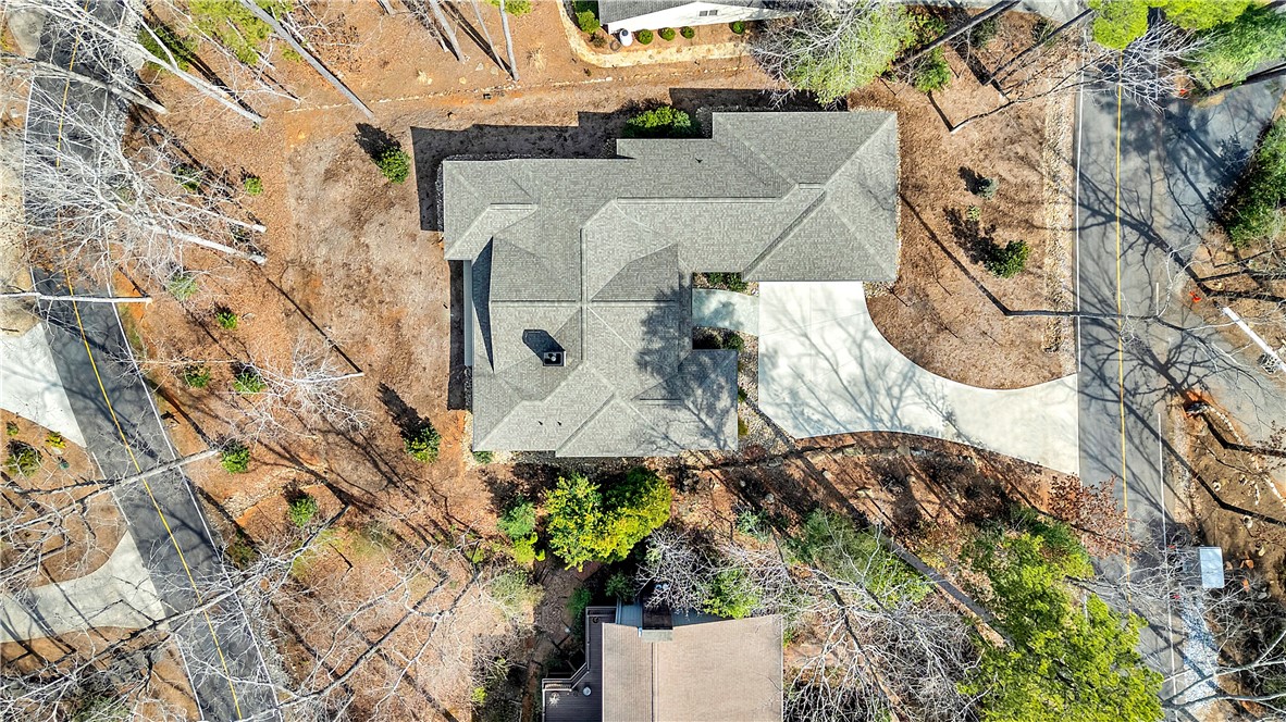 10 Admiral Lane Salem, SC 29676 - Photo 36 of 43 An aerial perspective reveals the property nestled among natural surroundings, featuring a well-maintained roof and pathways.