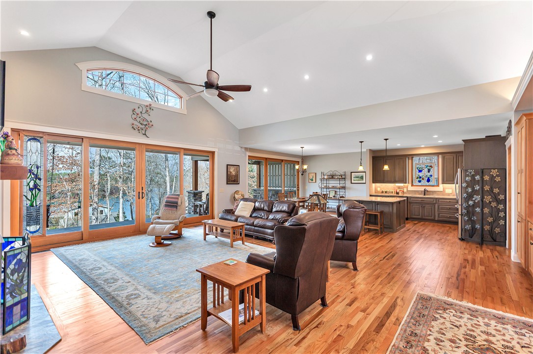 10 Admiral Lane Salem, SC 29676 - Photo 5 of 43 This airy open-concept living area with vaulted ceilings and lake views offers seamless indoor-outdoor living.