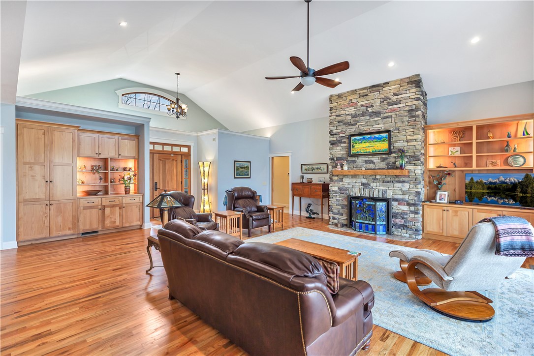 10 Admiral Lane Salem, SC 29676 - Photo 8 of 43 This living room features a fireplace and hardwood floors, offering a blend of warmth and style.