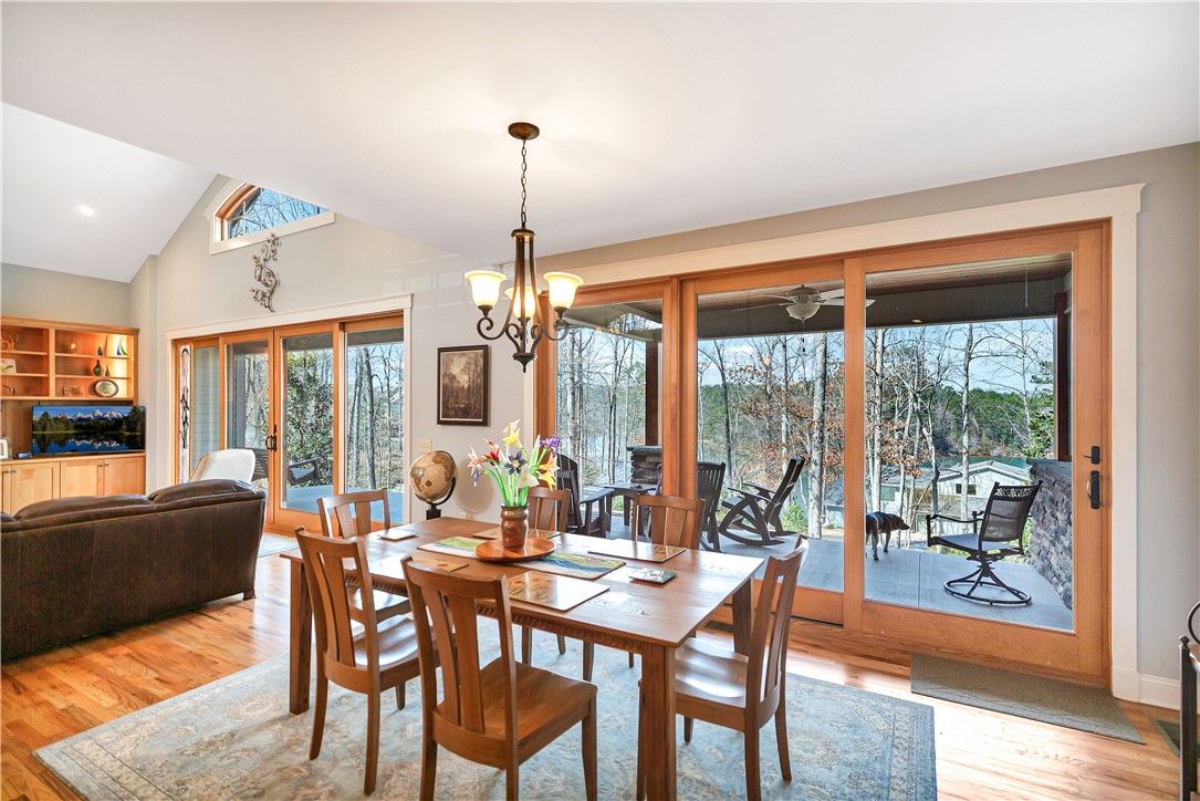 10 Admiral Lane Salem, SC 29676 - Photo 9 of 43 This inviting dining area seamlessly connects to the outdoors, offering panoramic views.