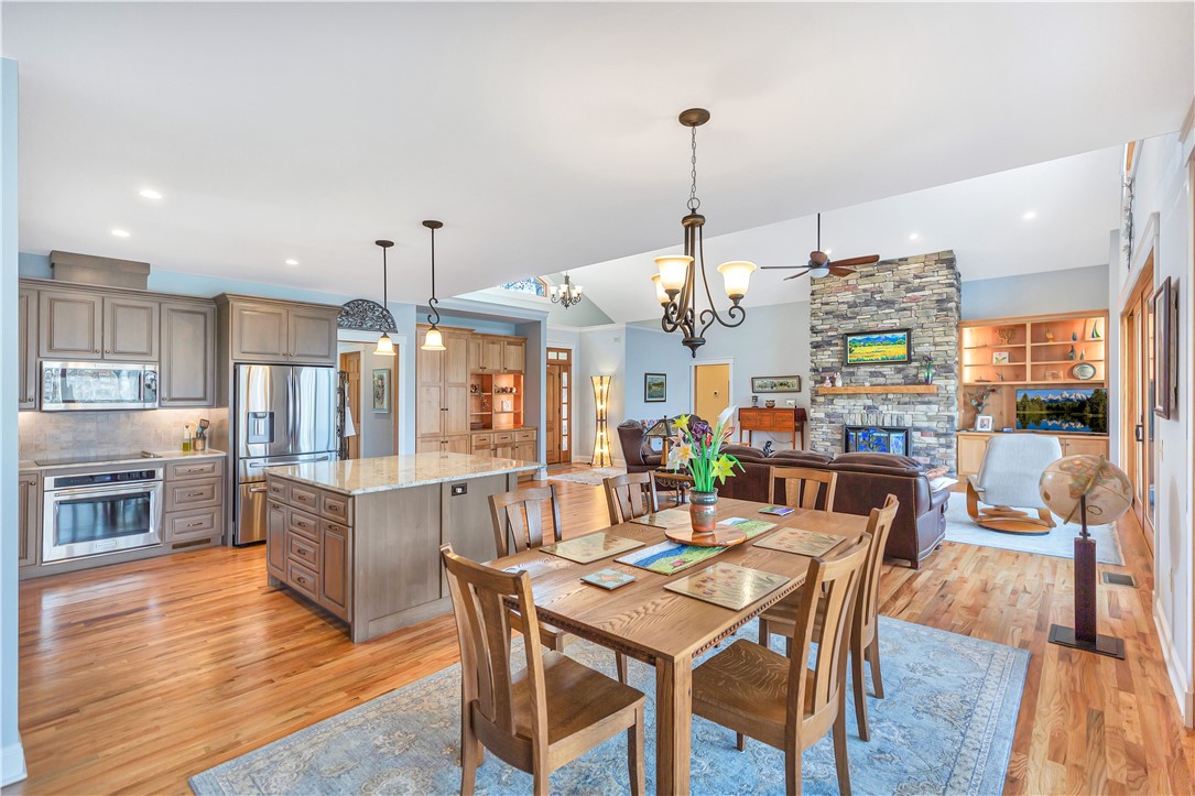 10 Admiral Lane Salem, SC 29676 - Photo 10 of 43 This open concept living space features a gourmet kitchen, an inviting dining area, and a cozy fireplace.
