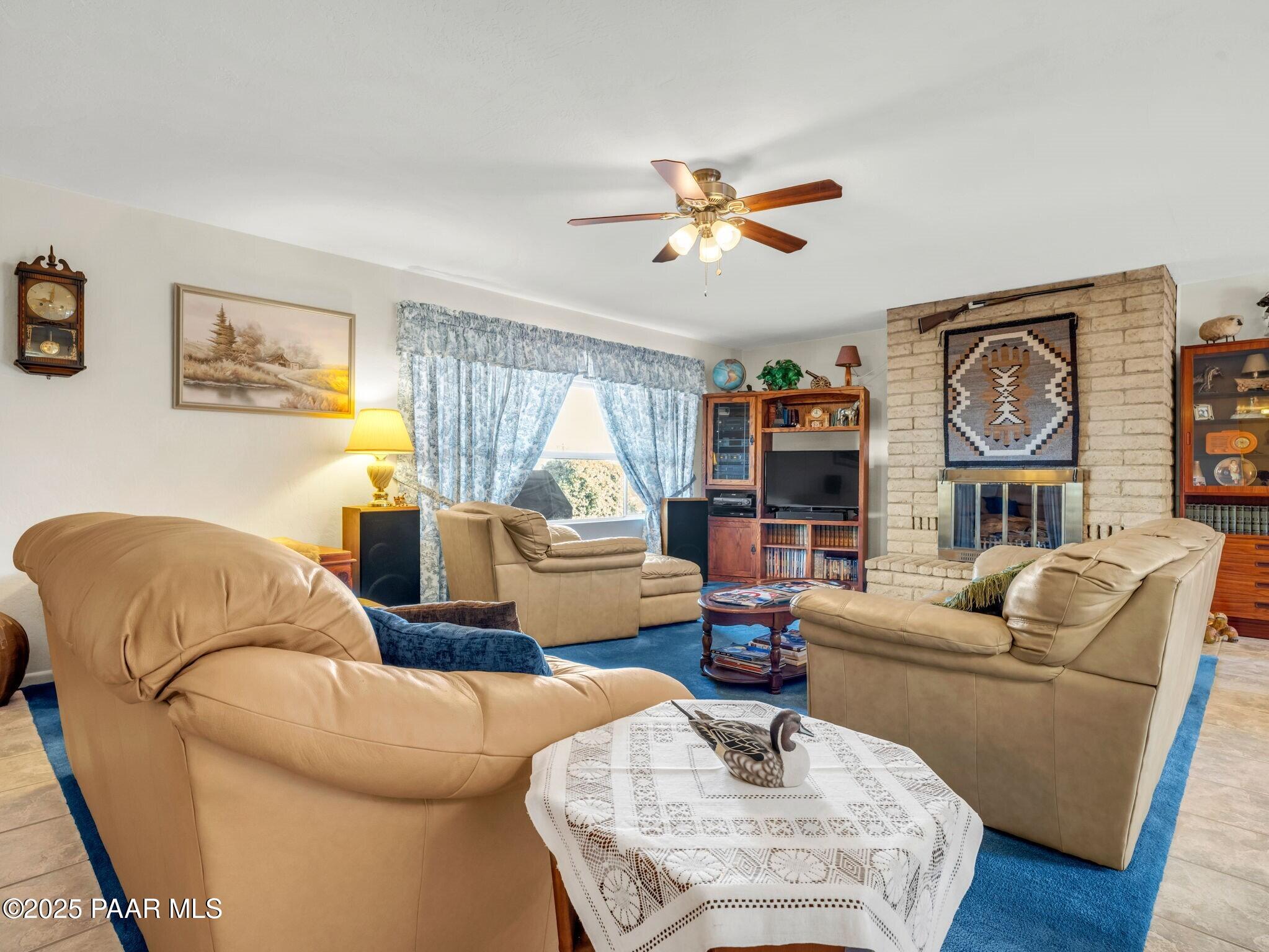 2710 Ridge Road Prescott, AZ 86301 - Photo 12 of 32 a living room with furniture and a large window