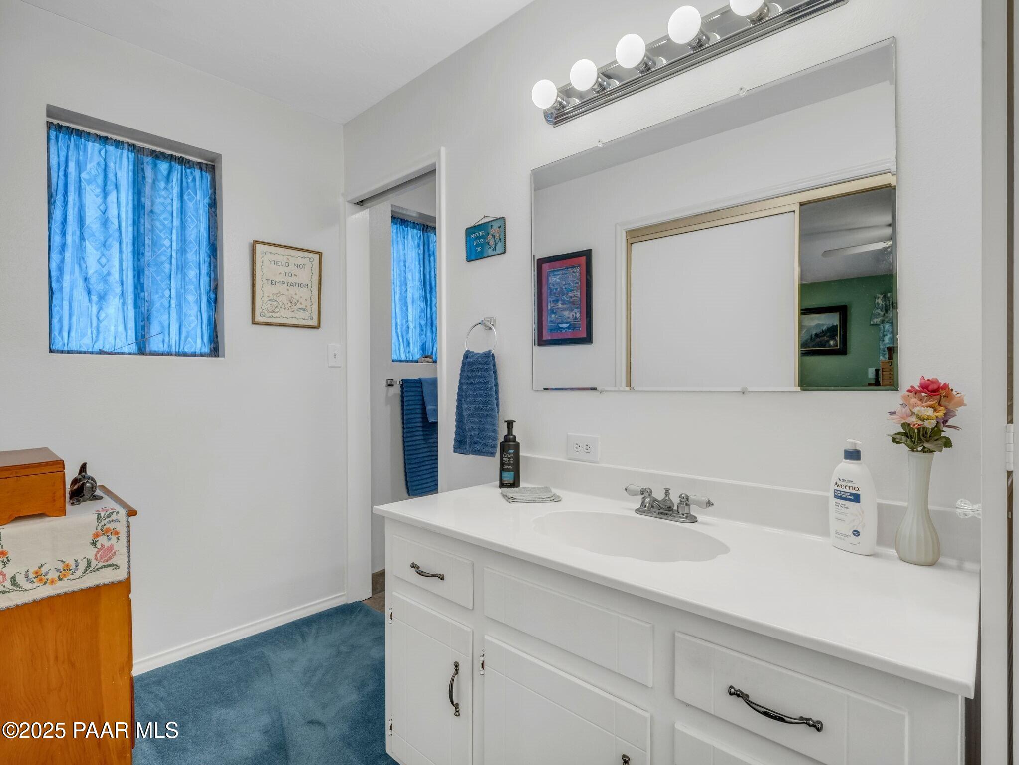 2710 Ridge Road Prescott, AZ 86301 - Photo 17 of 32 a bathroom with a sink and a mirror