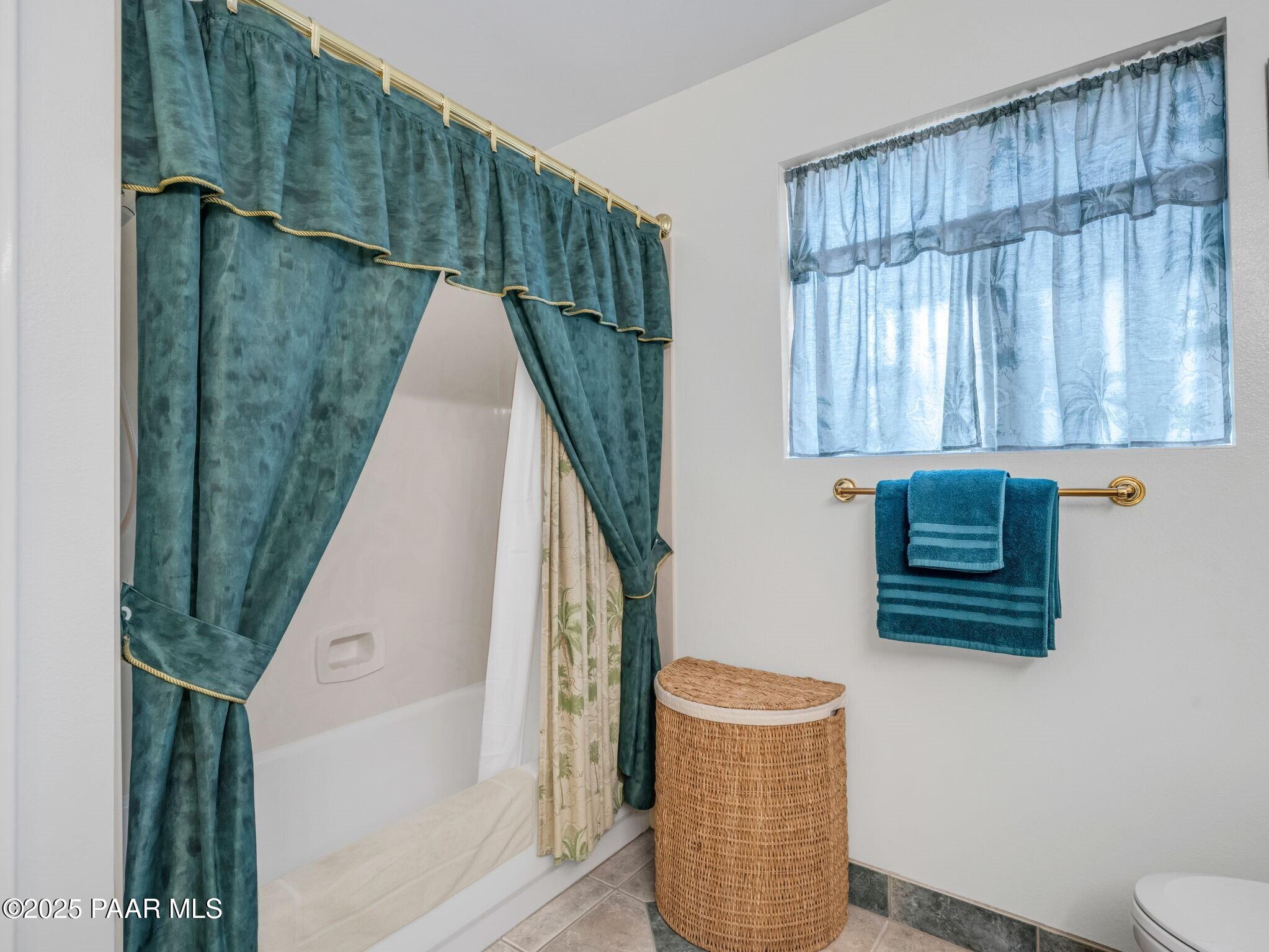 2710 Ridge Road Prescott, AZ 86301 - Photo 22 of 32 a bathroom with a toilet a sink and mirror