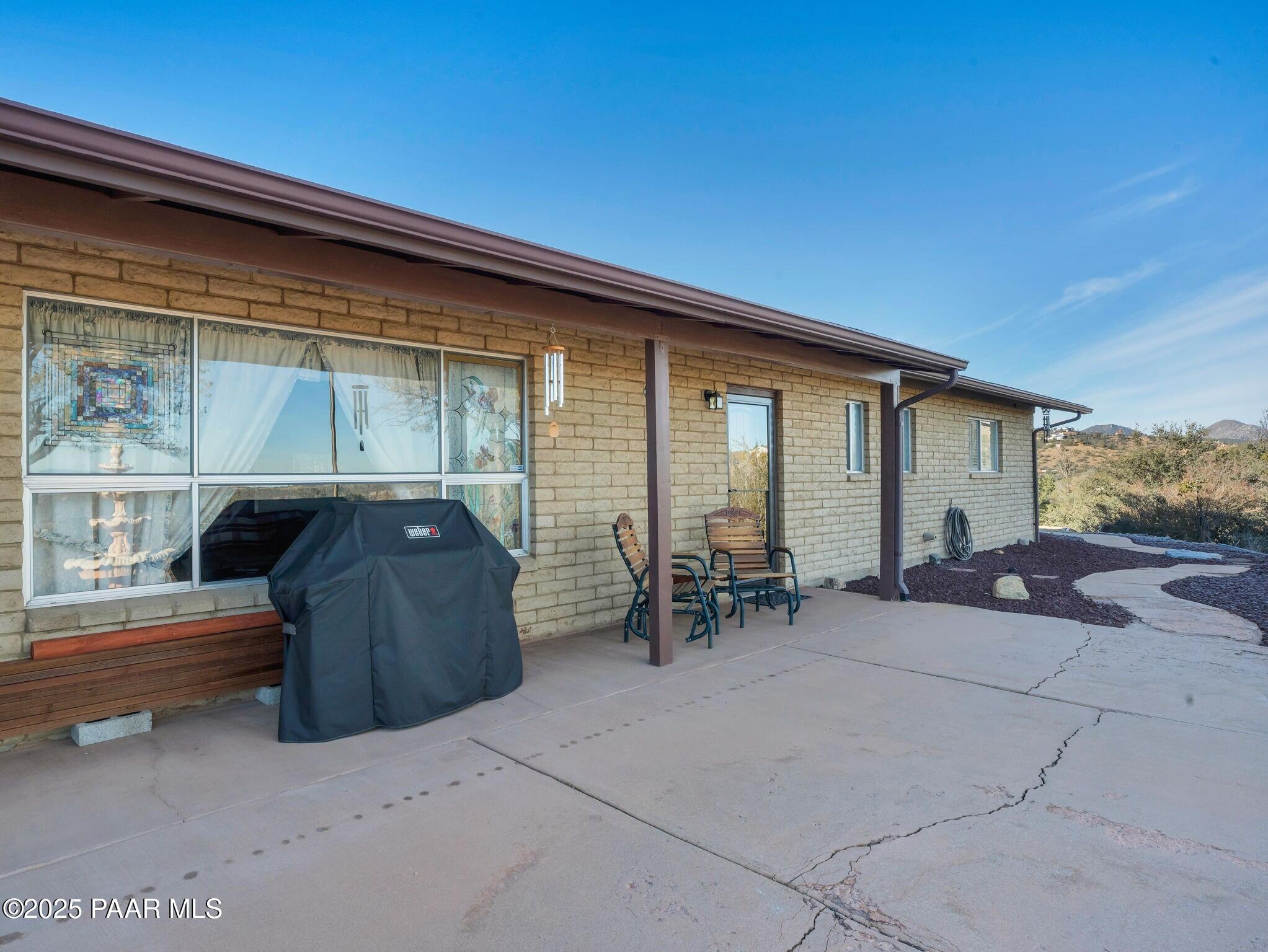 2710 Ridge Road Prescott, AZ 86301 - Photo 24 of 32 a backyard of a house with outdoor seating