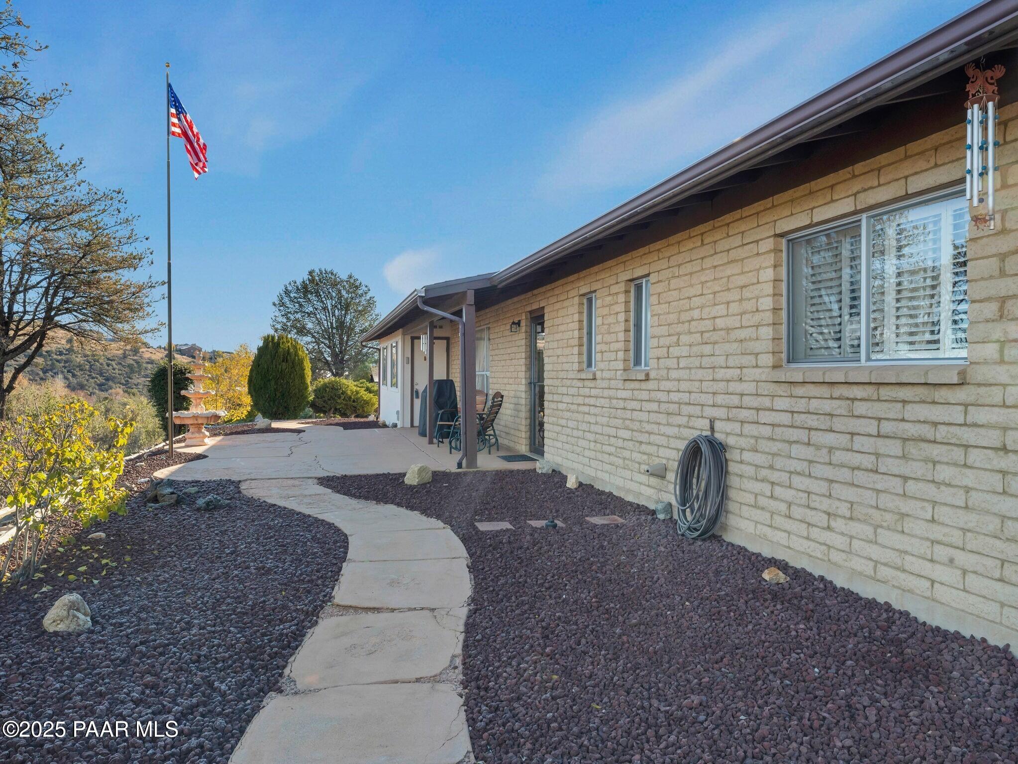 2710 Ridge Road Prescott, AZ 86301 - Photo 25 of 32 a front view of a house with a yard