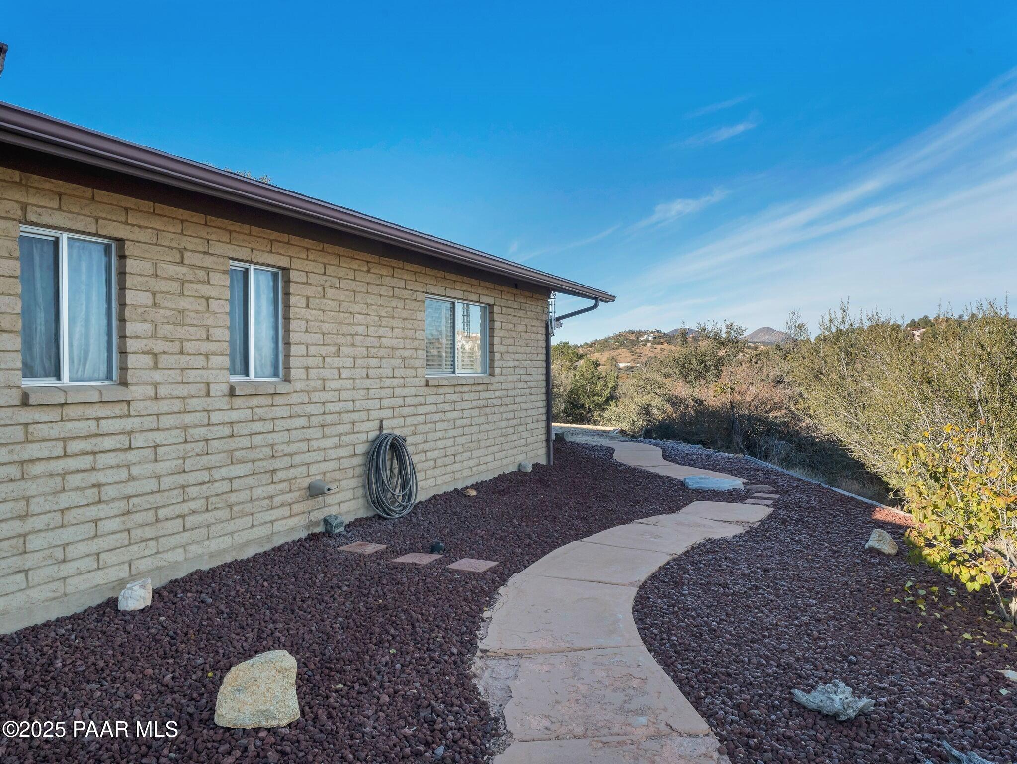 2710 Ridge Road Prescott, AZ 86301 - Photo 26 of 32 a view of a backyard with large trees