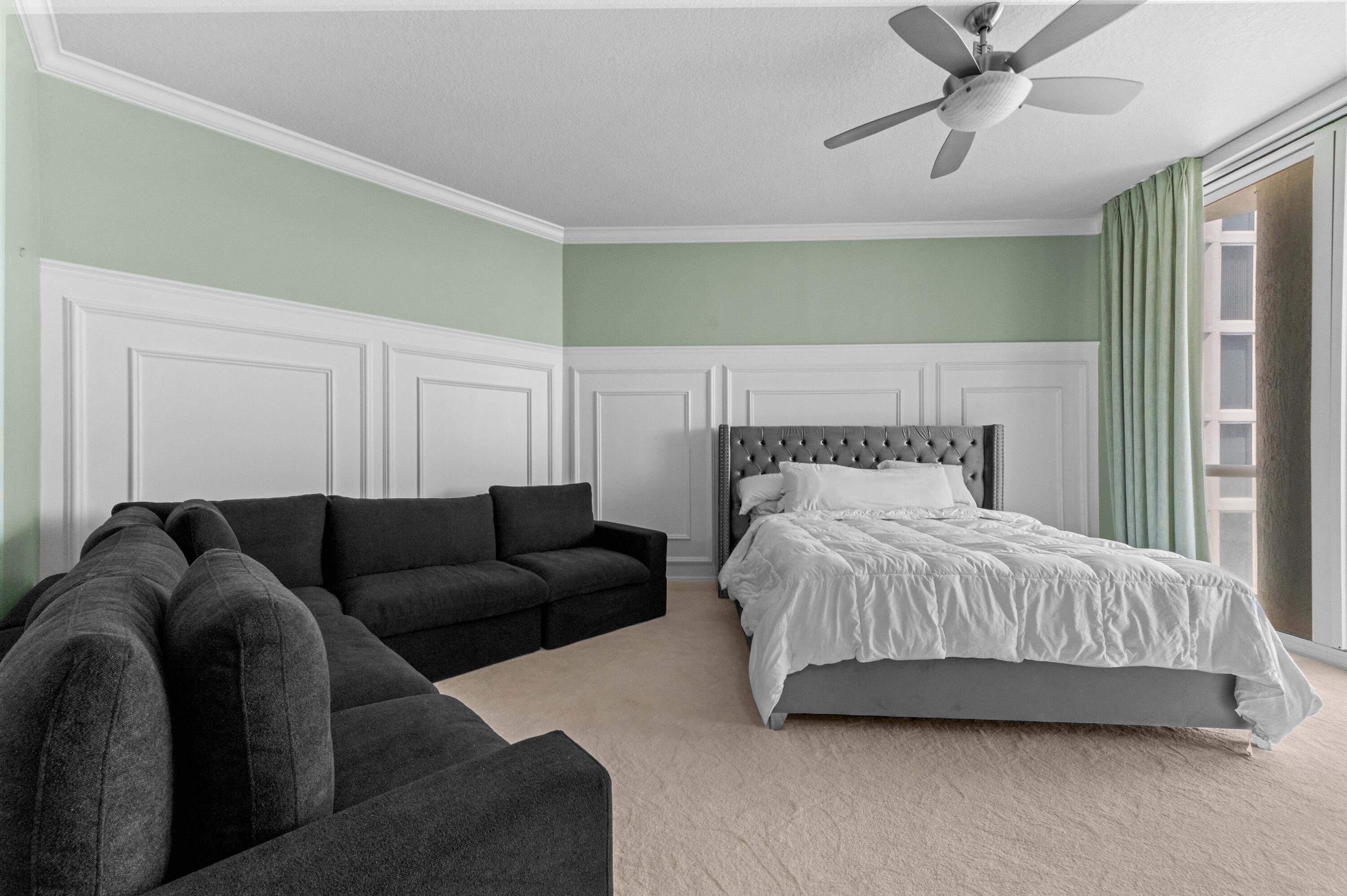 4600 North Ocean Drive, Unit 605 Riviera Beach, FL 33404 - Photo 20 of 65 a bedroom with a bed couch and window