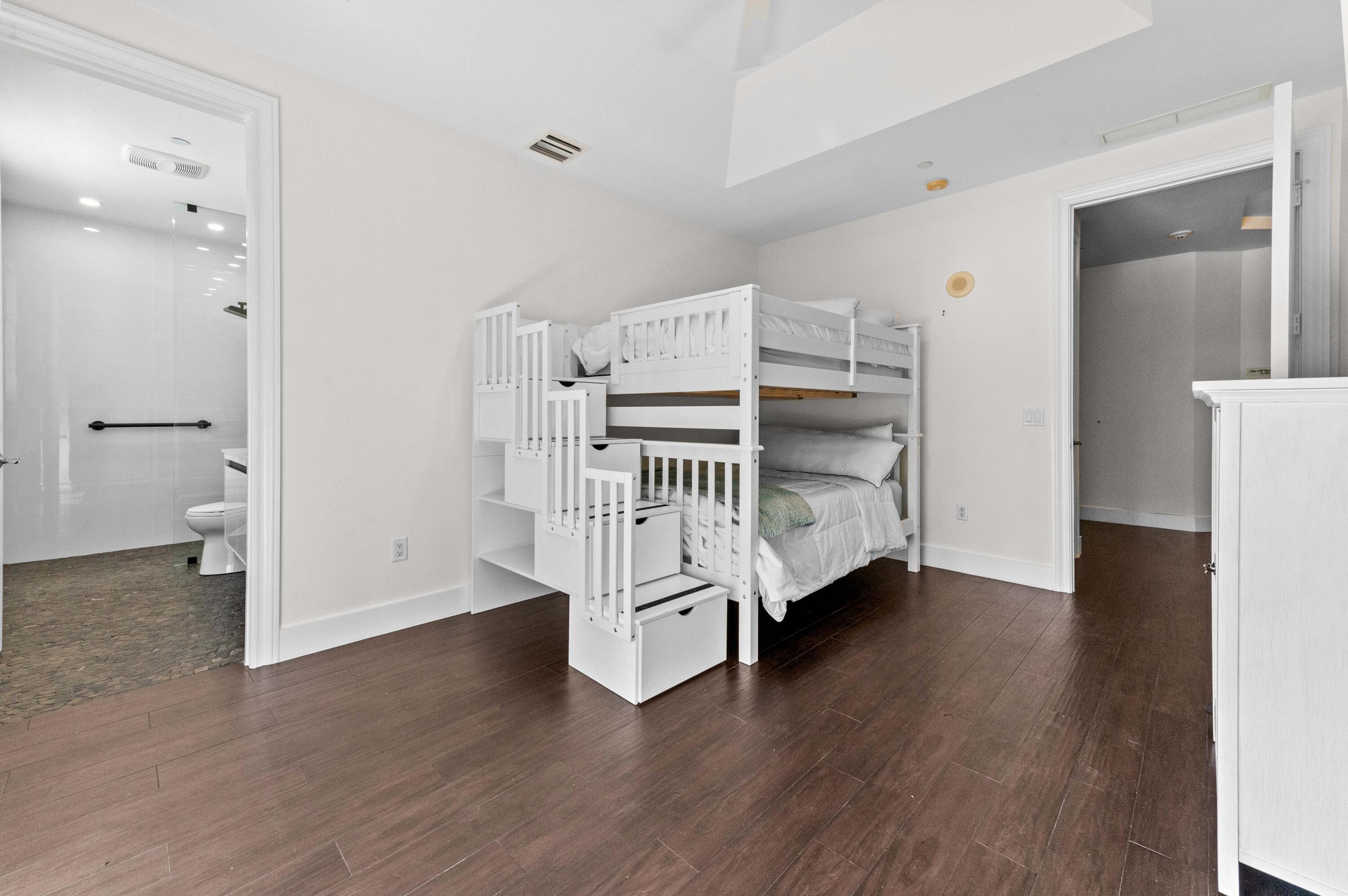 4600 North Ocean Drive, Unit 605 Riviera Beach, FL 33404 - Photo 32 of 65 a view of an empty room with a window and wooden floor