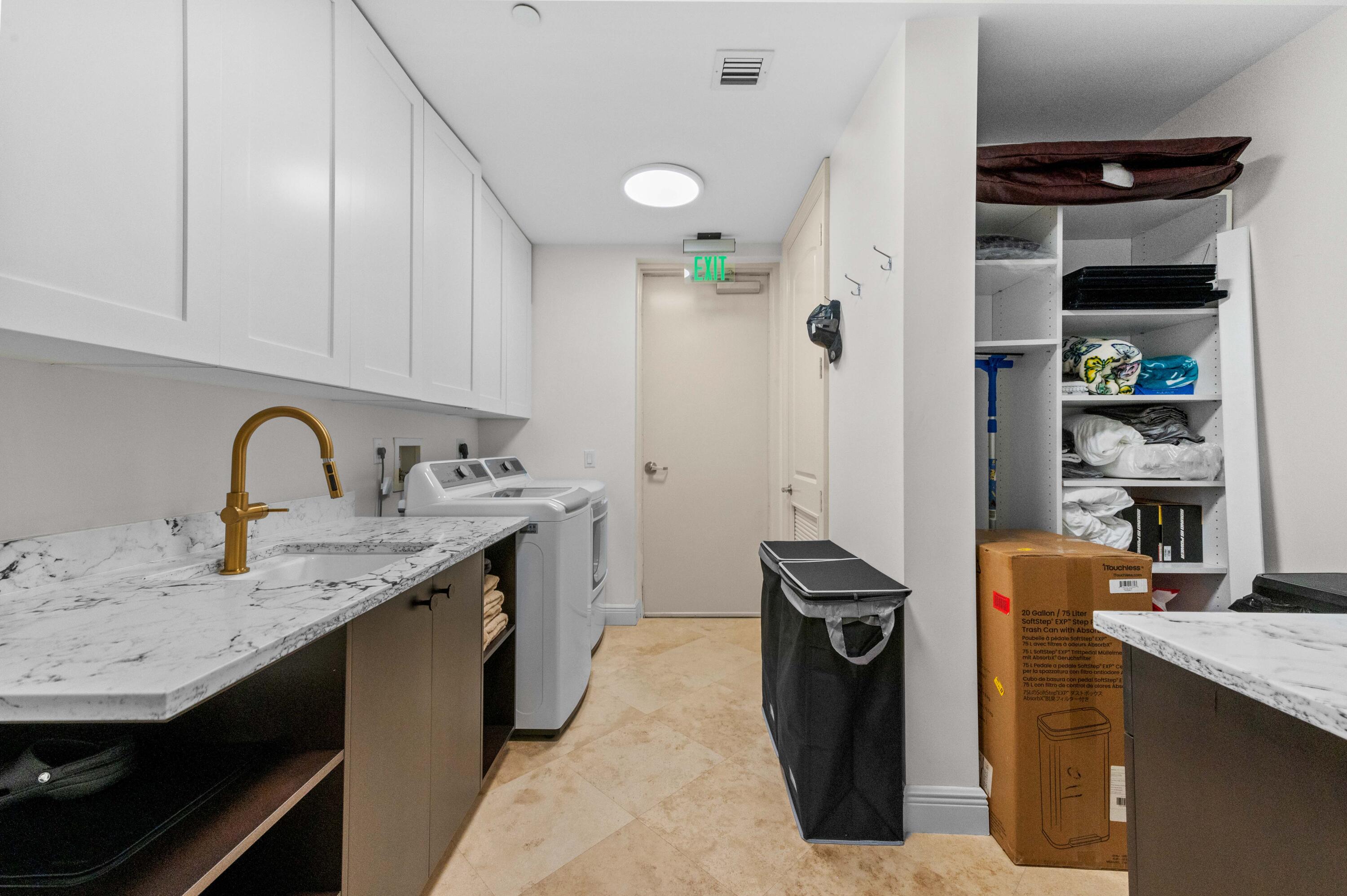 4600 North Ocean Drive, Unit 605 Riviera Beach, FL 33404 - Photo 35 of 65 a kitchen with stainless steel appliances granite countertop a sink stove and refrigerator