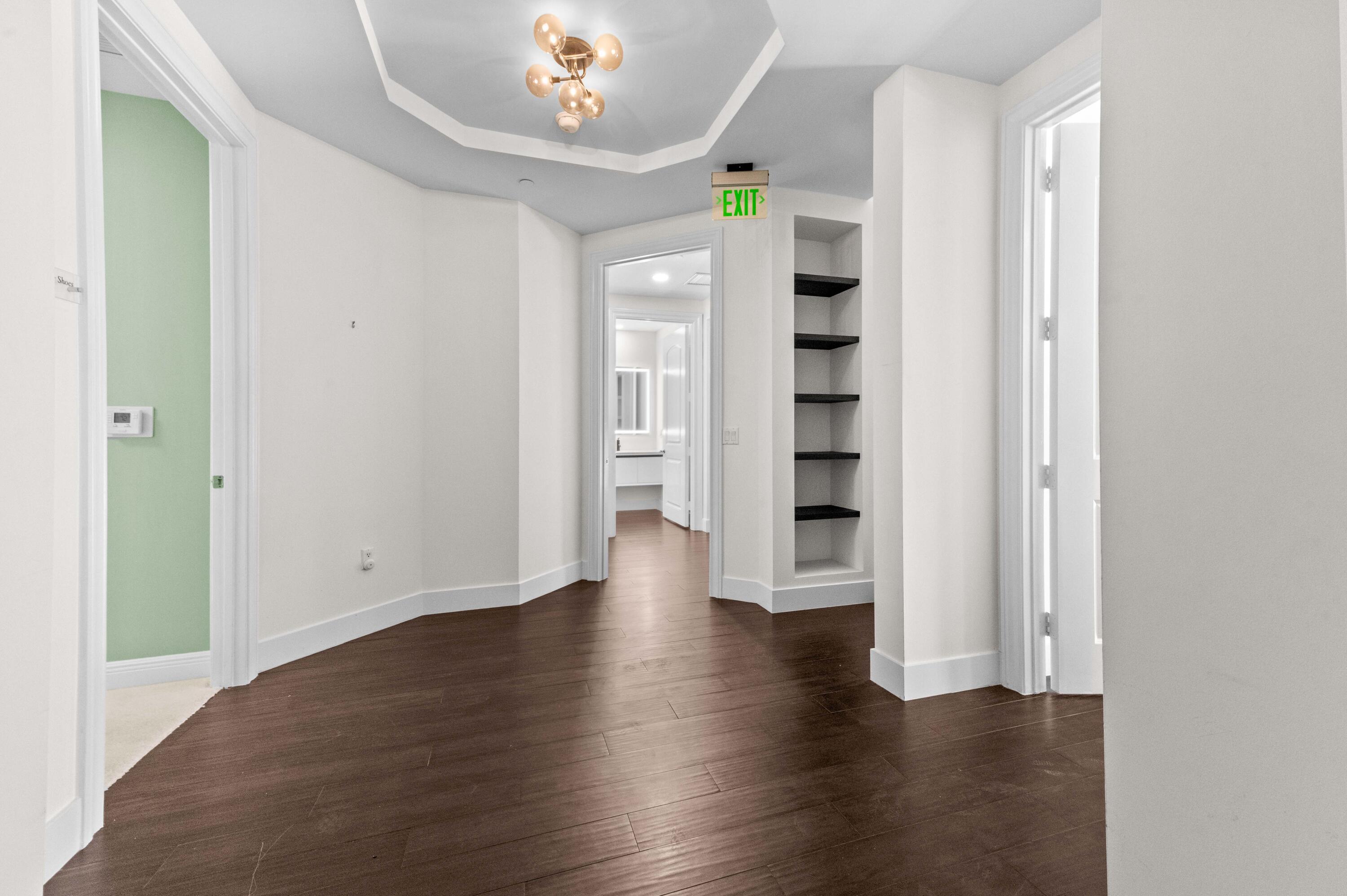 4600 North Ocean Drive, Unit 605 Riviera Beach, FL 33404 - Photo 38 of 65 an empty room with wooden floor and windows