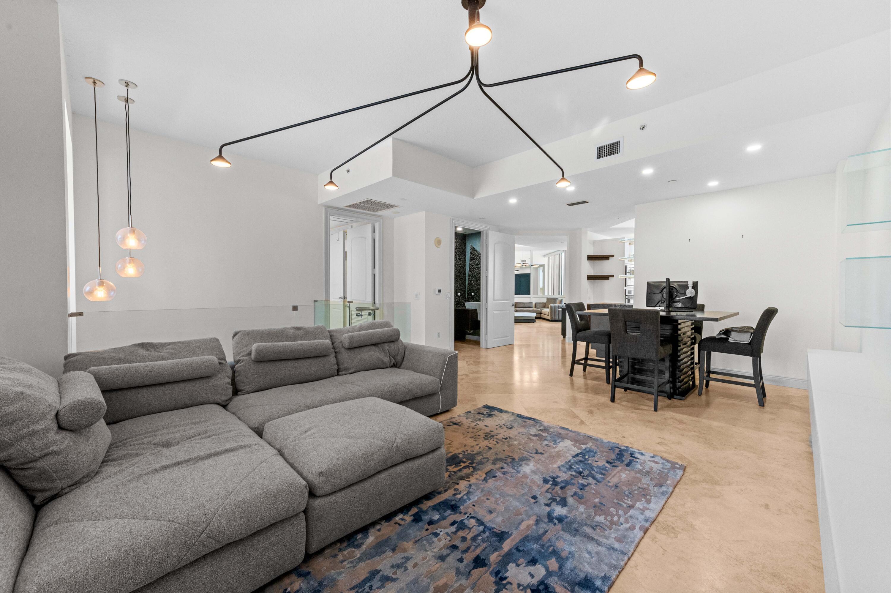 4600 North Ocean Drive, Unit 605 Riviera Beach, FL 33404 - Photo 6 of 65 a living room with furniture and wooden floor