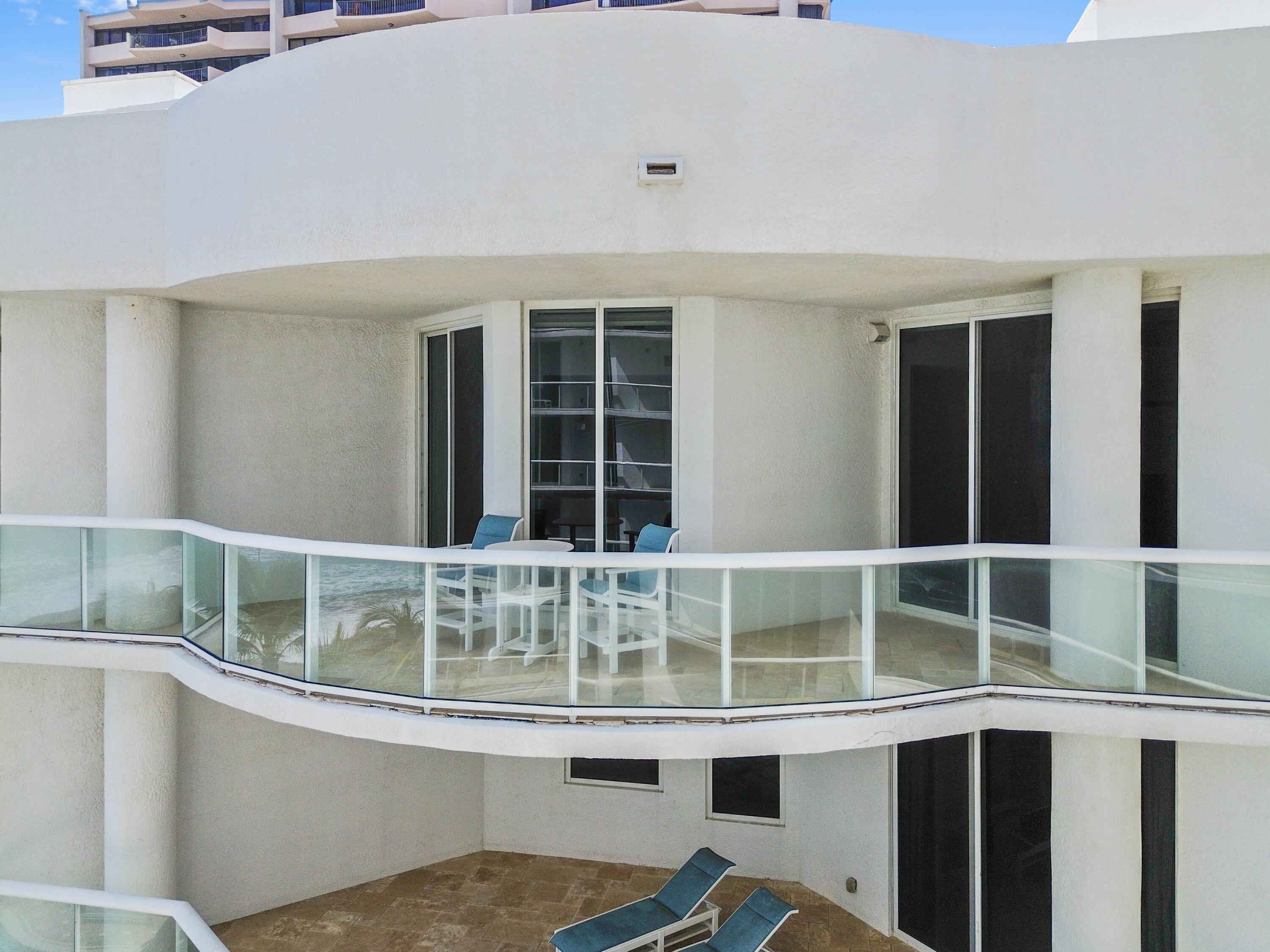 4600 North Ocean Drive, Unit 605 Riviera Beach, FL 33404 - Photo 61 of 65 a room with a large window and chandelier