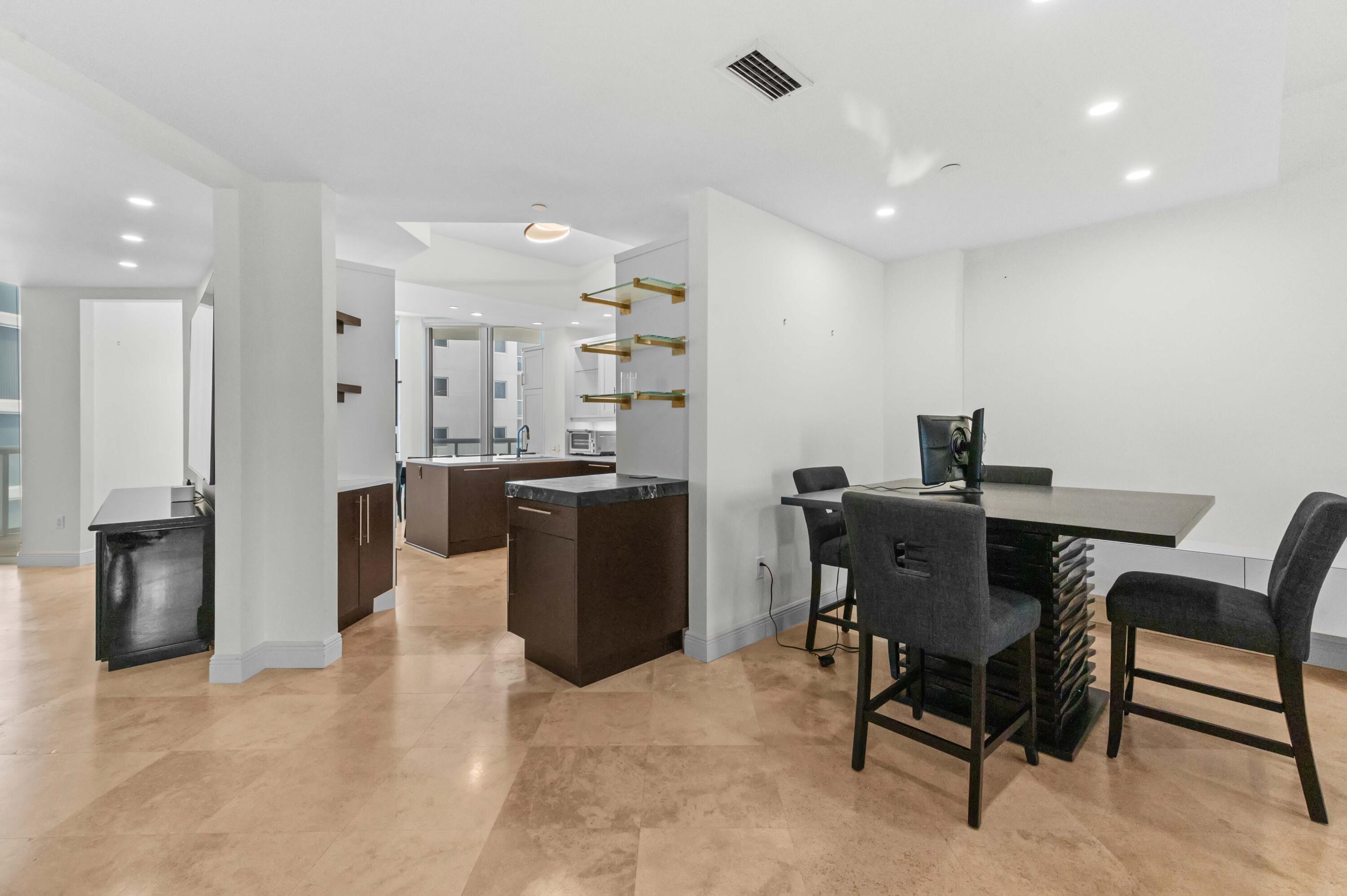 4600 North Ocean Drive, Unit 605 Riviera Beach, FL 33404 - Photo 10 of 65 a view of a dining room with furniture