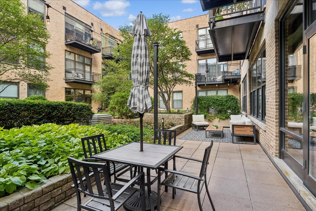 1040 West Adams Street, Unit 344 Chicago, IL 60607 - Photo 26 of 31 a view of outdoor dining space with a patio