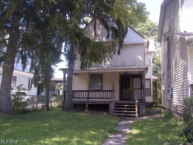 863 West Prospect Road Ashtabula, OH 44004 - Photo 1 of 9 View of front of home with a porch and a front yard